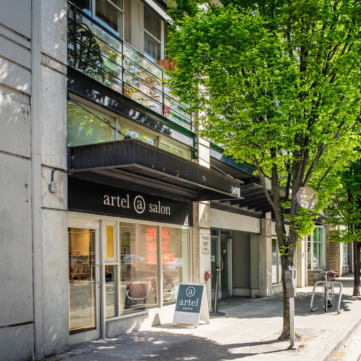 Street view of the salon on 6th Avenue West in Vancouver, with a maple tree over the sidewalk